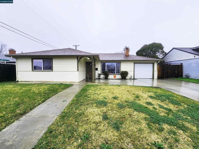 single story home with a garage and a front lawn