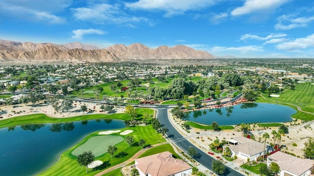 aerial view featuring a water and mountain view