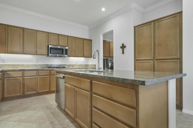 kitchen featuring sink, crown molding, light tile patterned floors, light stone counters, and an island with sink