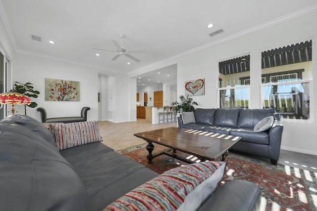 living room featuring crown molding and ceiling fan