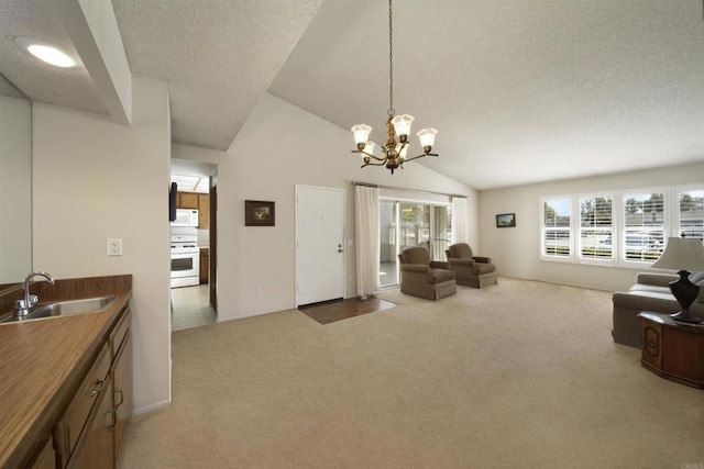 living room with lofted ceiling, sink, carpet, a notable chandelier, and a textured ceiling