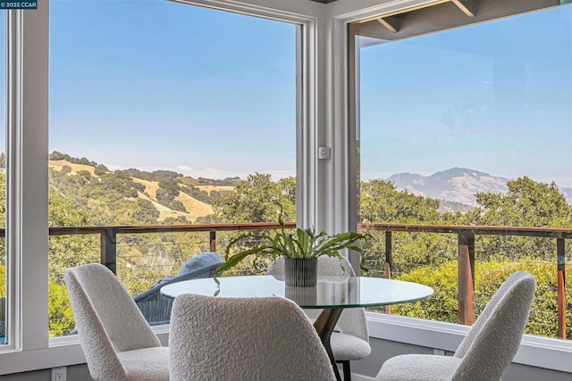 sunroom with a mountain view