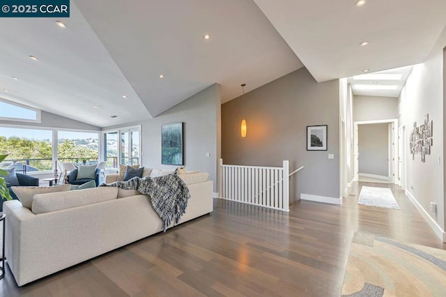 living room featuring hardwood / wood-style floors and high vaulted ceiling