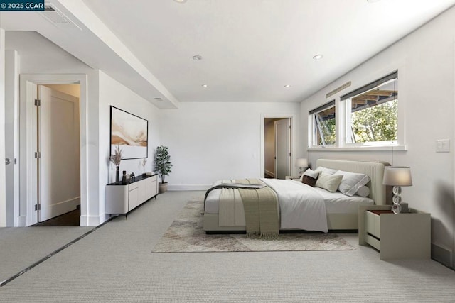 bedroom featuring light carpet