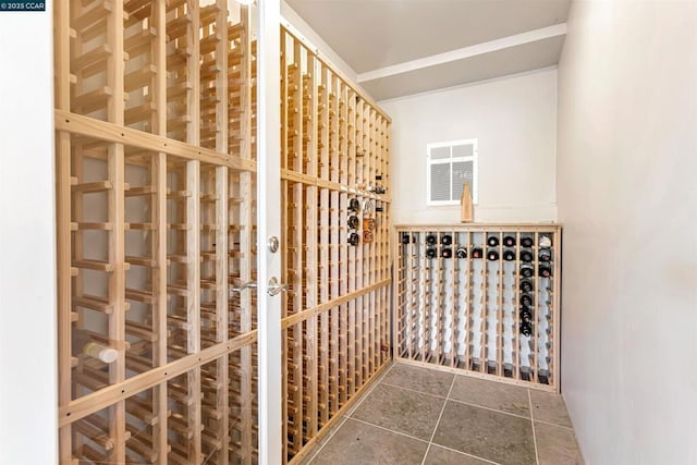 wine area with dark tile patterned flooring