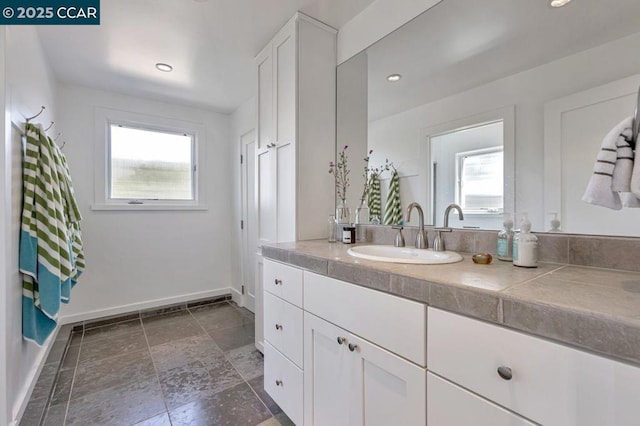 bathroom featuring plenty of natural light and vanity