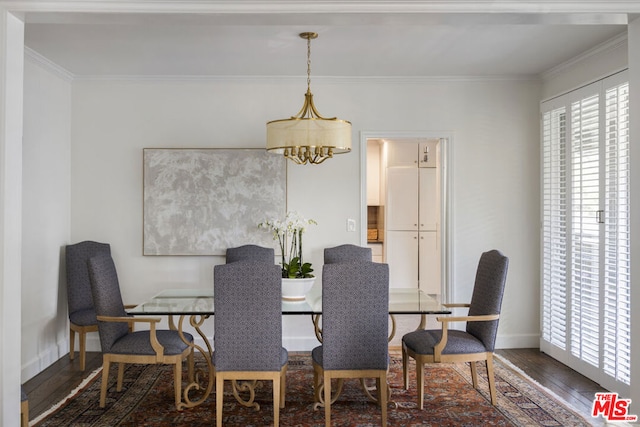 dining room with ornamental molding, a chandelier, and dark hardwood / wood-style flooring