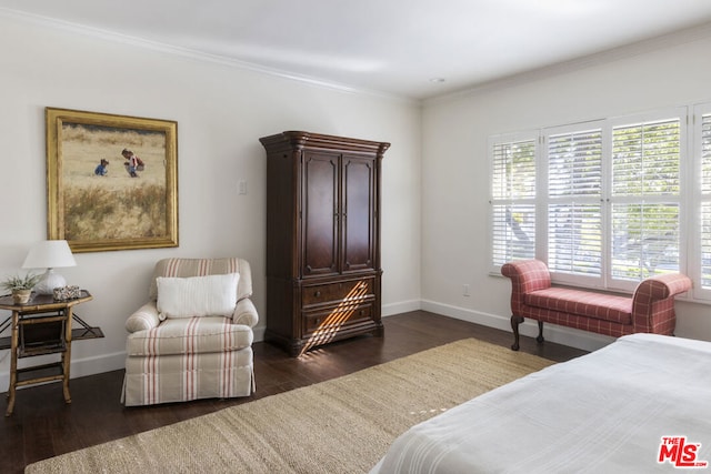 bedroom with crown molding and dark hardwood / wood-style floors