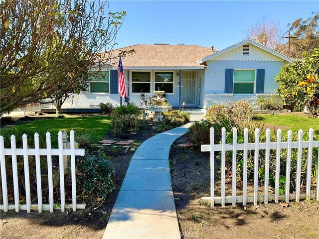 view of front of home with a front lawn