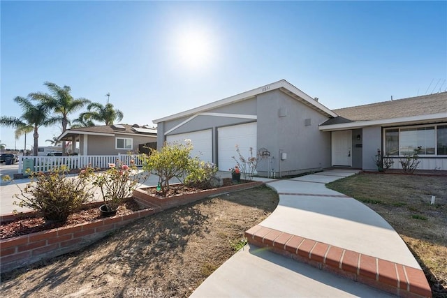 ranch-style house featuring a garage