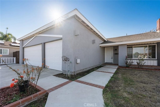 single story home featuring a garage