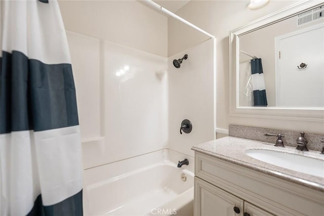 bathroom with shower / bath combo and vanity