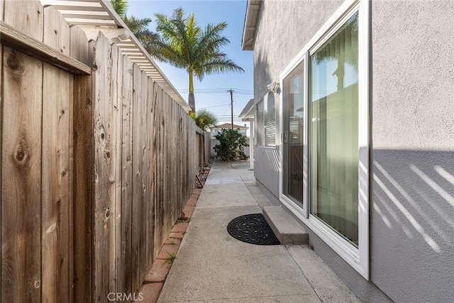 view of side of property featuring a patio