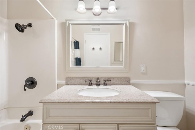 full bathroom with shower / bathtub combination with curtain, vanity, and toilet