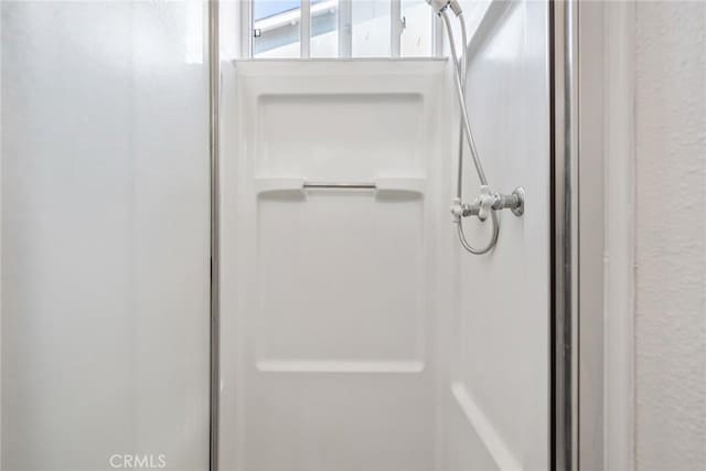 bathroom featuring walk in shower