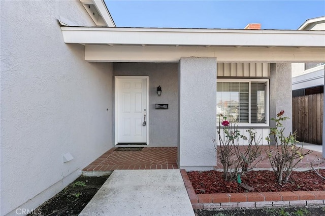 entrance to property featuring covered porch