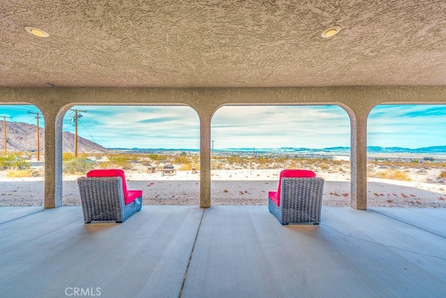 view of patio / terrace with a mountain view