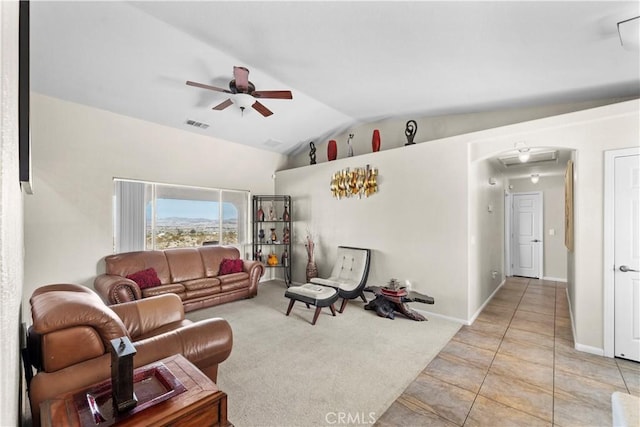 tiled living room with vaulted ceiling and ceiling fan