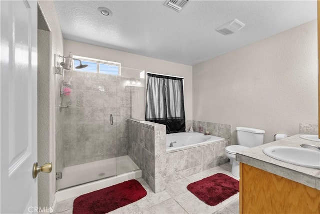 full bathroom with toilet, vanity, plus walk in shower, and tile patterned flooring