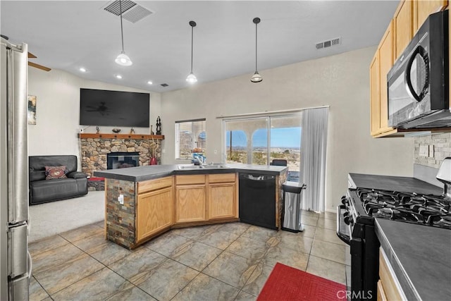 kitchen with pendant lighting, a fireplace, sink, black appliances, and light brown cabinets