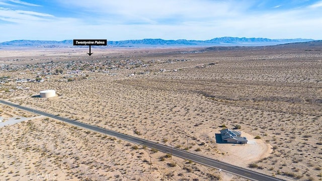 birds eye view of property featuring a mountain view