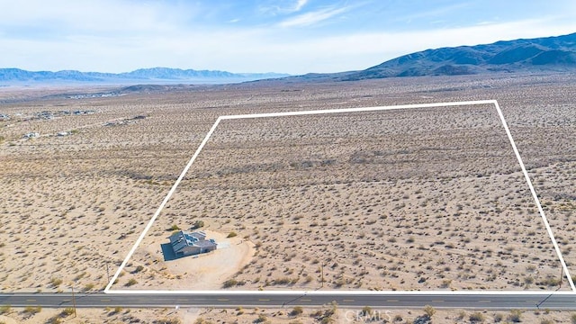 drone / aerial view featuring a mountain view