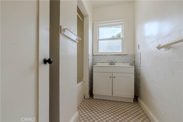 bathroom featuring vanity and shower / bathtub combination