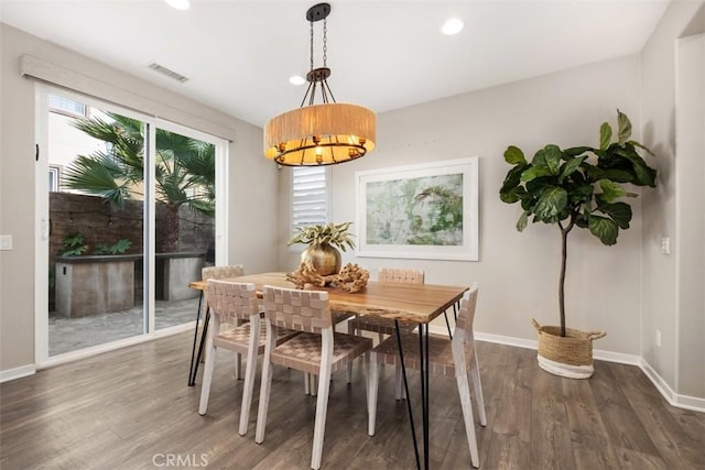 dining space with dark wood-type flooring