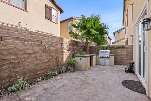 view of patio with a grill