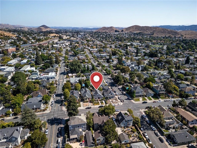 birds eye view of property featuring a mountain view