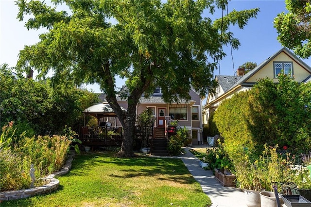 obstructed view of property featuring a gazebo and a front lawn