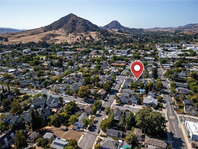 birds eye view of property with a mountain view