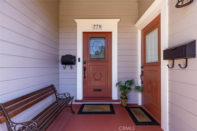 view of exterior entry featuring a porch