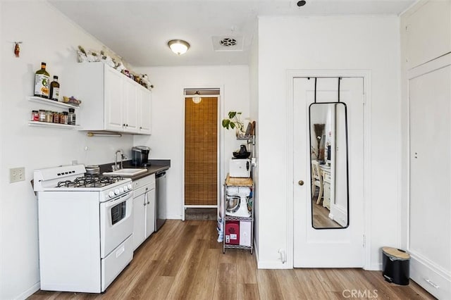 kitchen with sink, light hardwood / wood-style flooring, white gas range oven, dishwasher, and white cabinetry