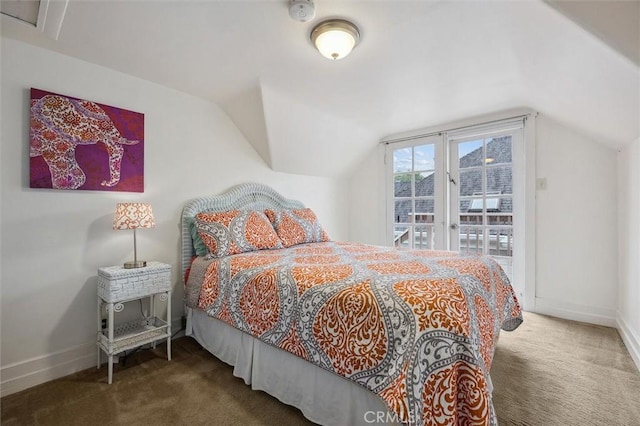 bedroom featuring lofted ceiling, access to outside, and dark colored carpet