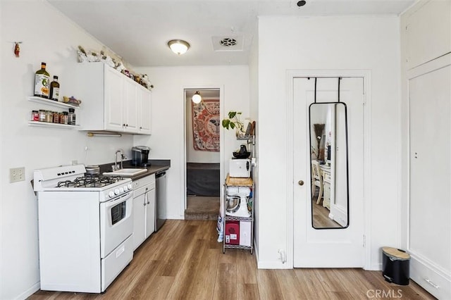 kitchen featuring white cabinetry, dishwasher, sink, white gas stove, and light wood-type flooring