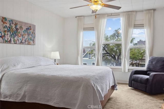 bedroom featuring ceiling fan and light colored carpet