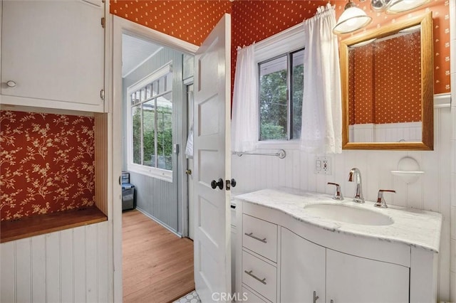 bathroom with vanity and hardwood / wood-style floors