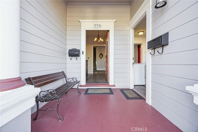 view of exterior entry with covered porch