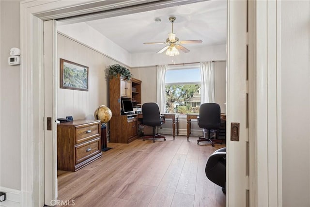 office space featuring ceiling fan and light wood-type flooring