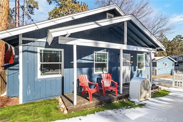 back of house with an outdoor structure