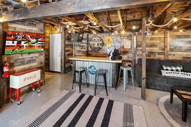 bar with beam ceiling and wooden walls