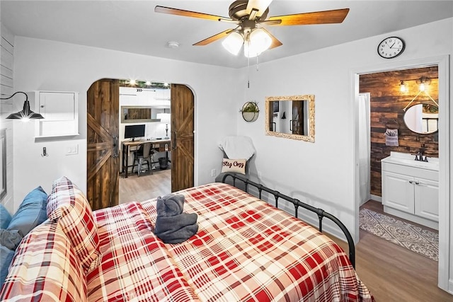 bedroom featuring ceiling fan and light wood-type flooring