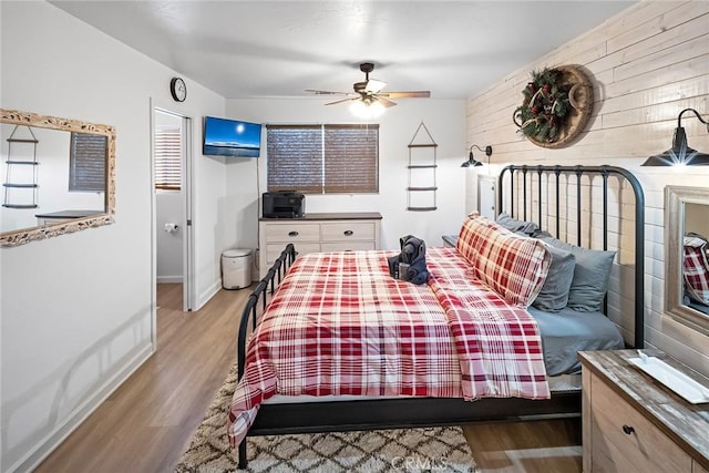 bedroom featuring light hardwood / wood-style flooring and ceiling fan