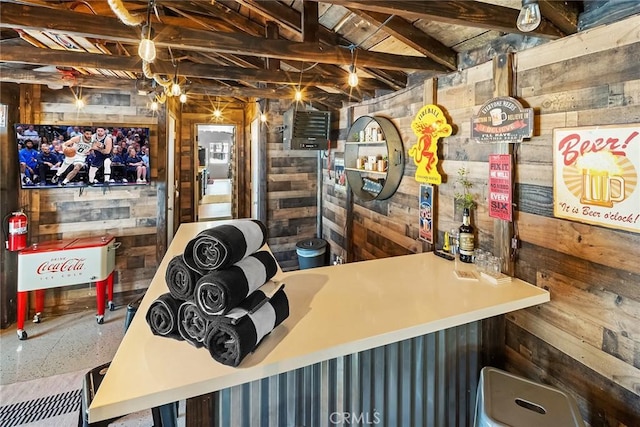 bar with beam ceiling and wood walls