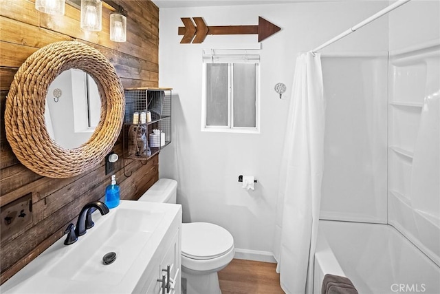 full bathroom with toilet, wood walls, wood-type flooring, vanity, and shower / bathtub combination with curtain