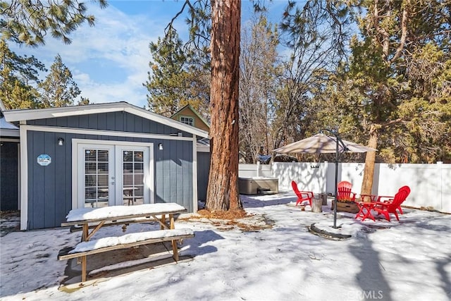 exterior space with an outdoor structure and a hot tub