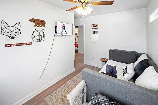 bedroom featuring hardwood / wood-style floors and ceiling fan