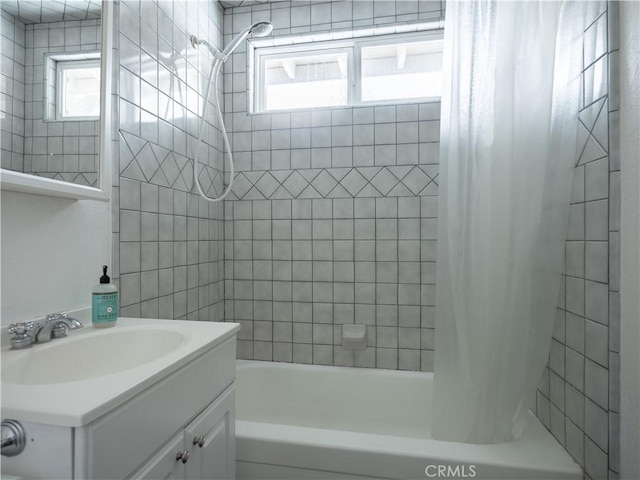 bathroom with vanity and shower / bath combo with shower curtain