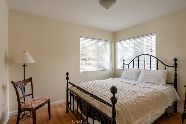 bedroom with wood-type flooring